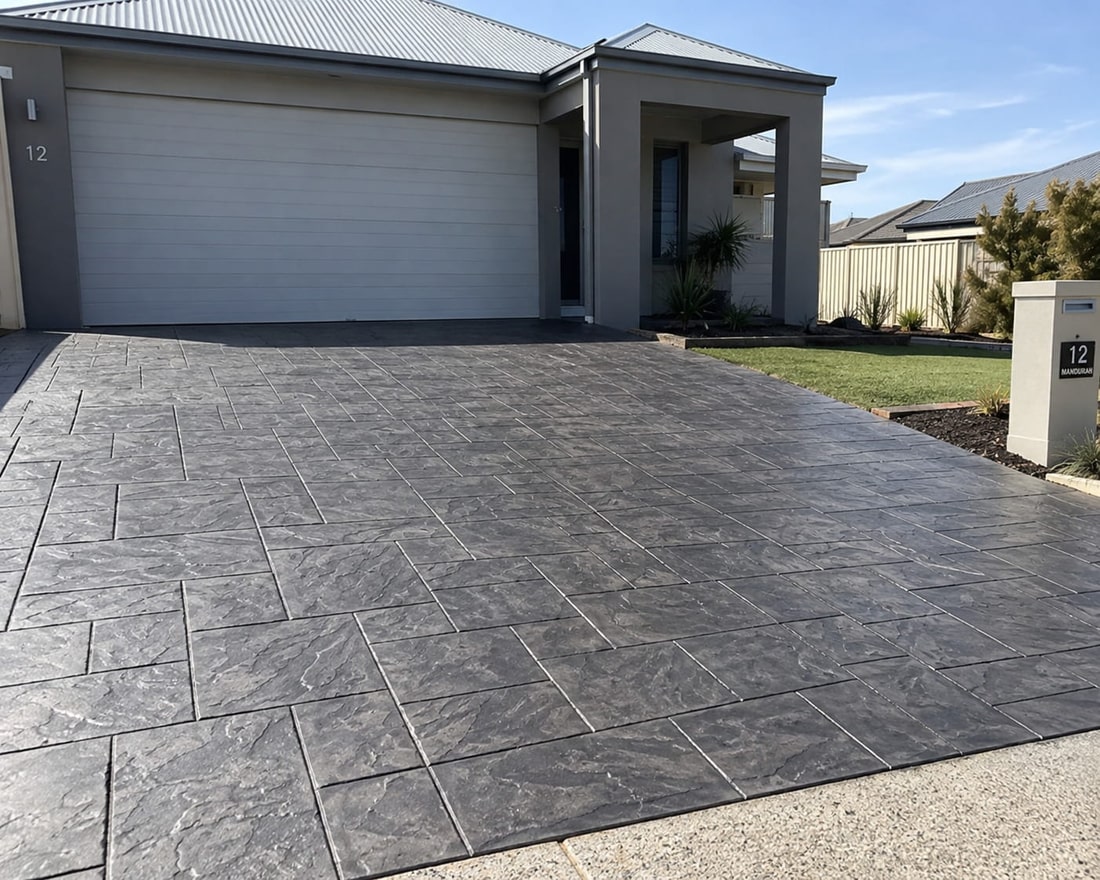 Slate-pattern stamped concrete driveway at a modern Canberra home