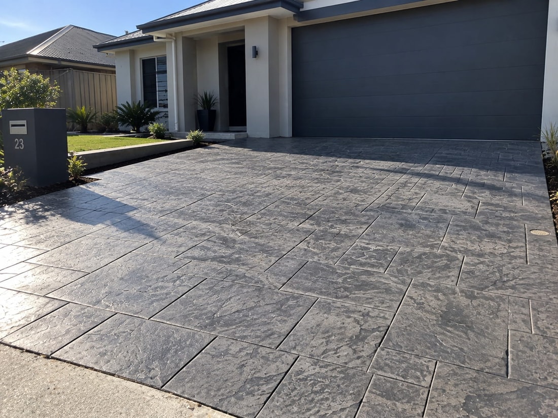 Charcoal flagstone stencilled concrete driveway at a Canberra home